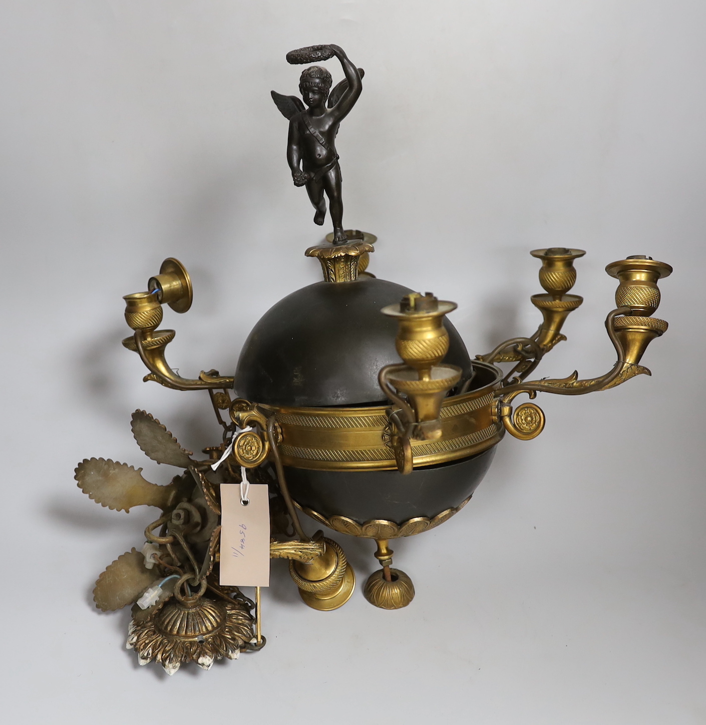 A two colour bronze cherub ceiling fitting, approx 40cm high